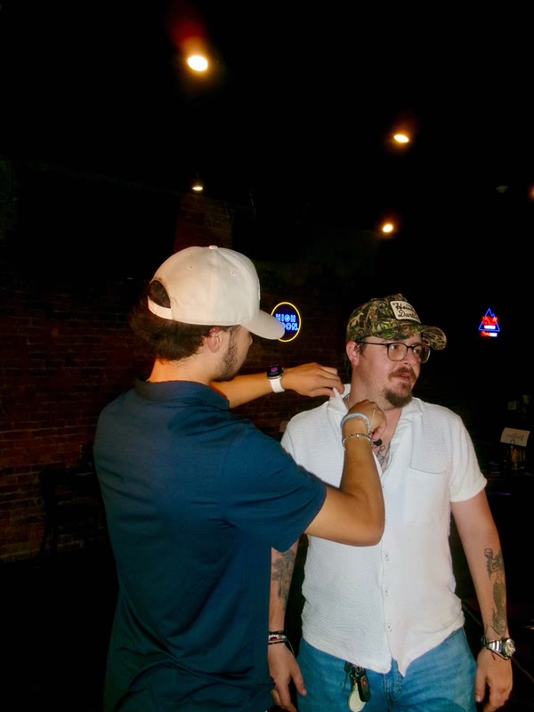 Jack Rossi at a bar with a friend