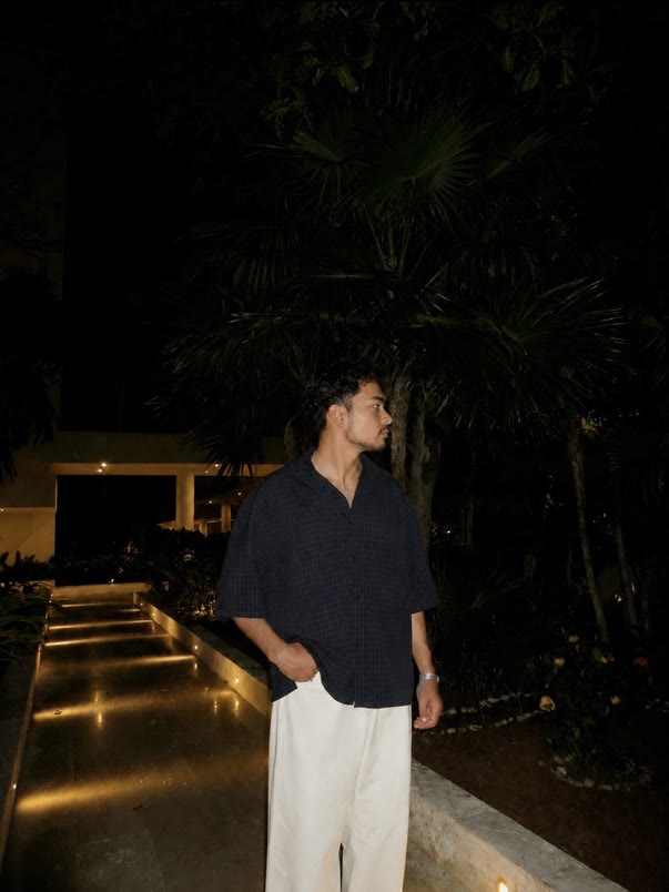 Jack Rossi at night with palm trees